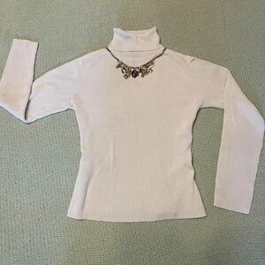 Ann Taylor cream colored turtleneck 
100% Silk